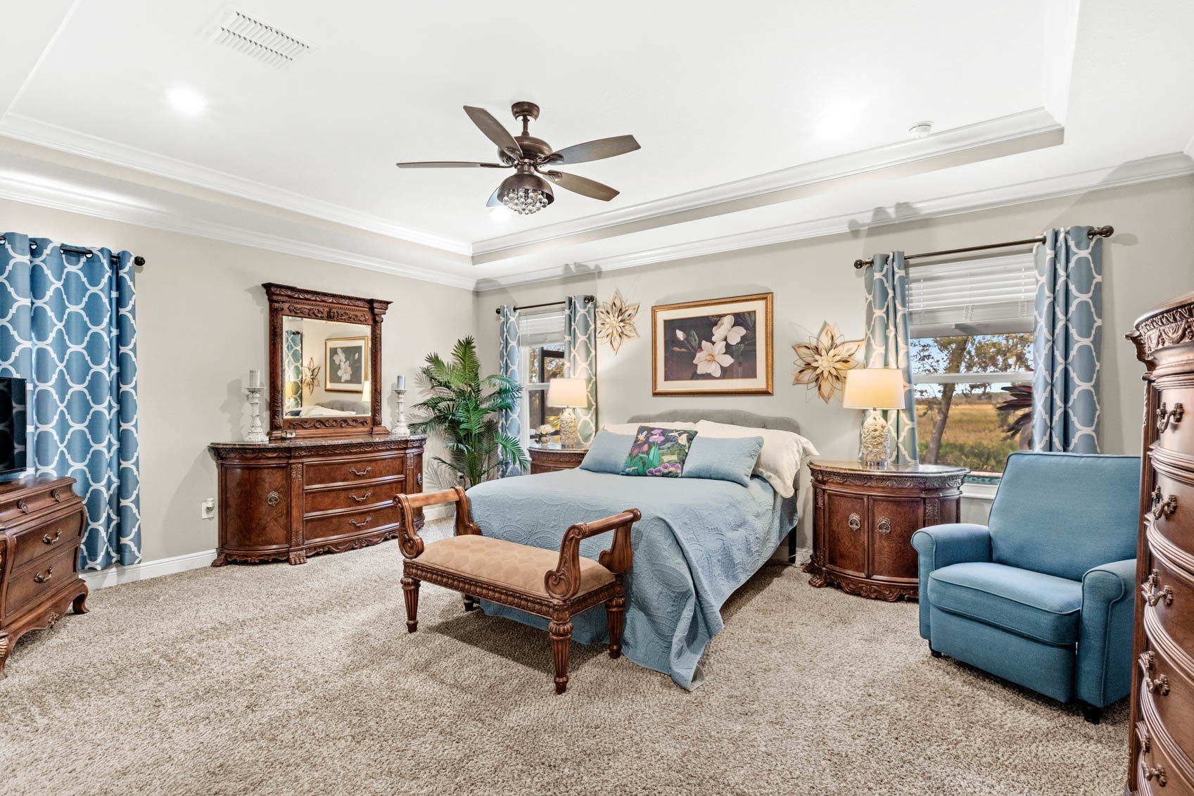 primary bedroom with brown wooden furniture